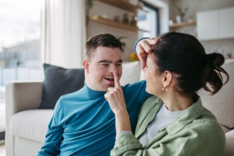 A young man with his mother is considering submitting a change of circumstances so he is better supported 