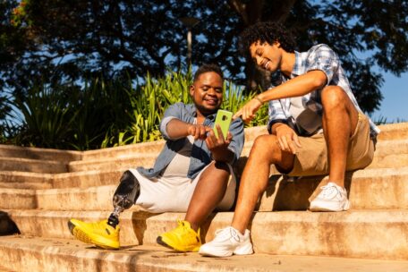 Two friends talk about change in situation and how it relates to SDA. One man has a prosthetic leg