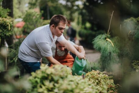 A downsyndrome man tends to his garden while thinking about a change of circumstances and SDA